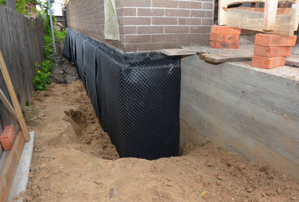 SJ Waterproofing Pros technician performing targeted Waterproofing assessment in Erlanger, KY